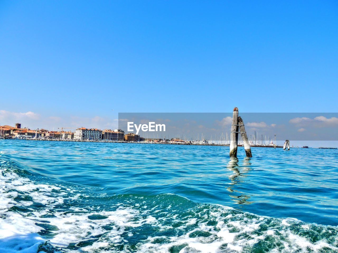 Scenic view of sea against clear blue sky