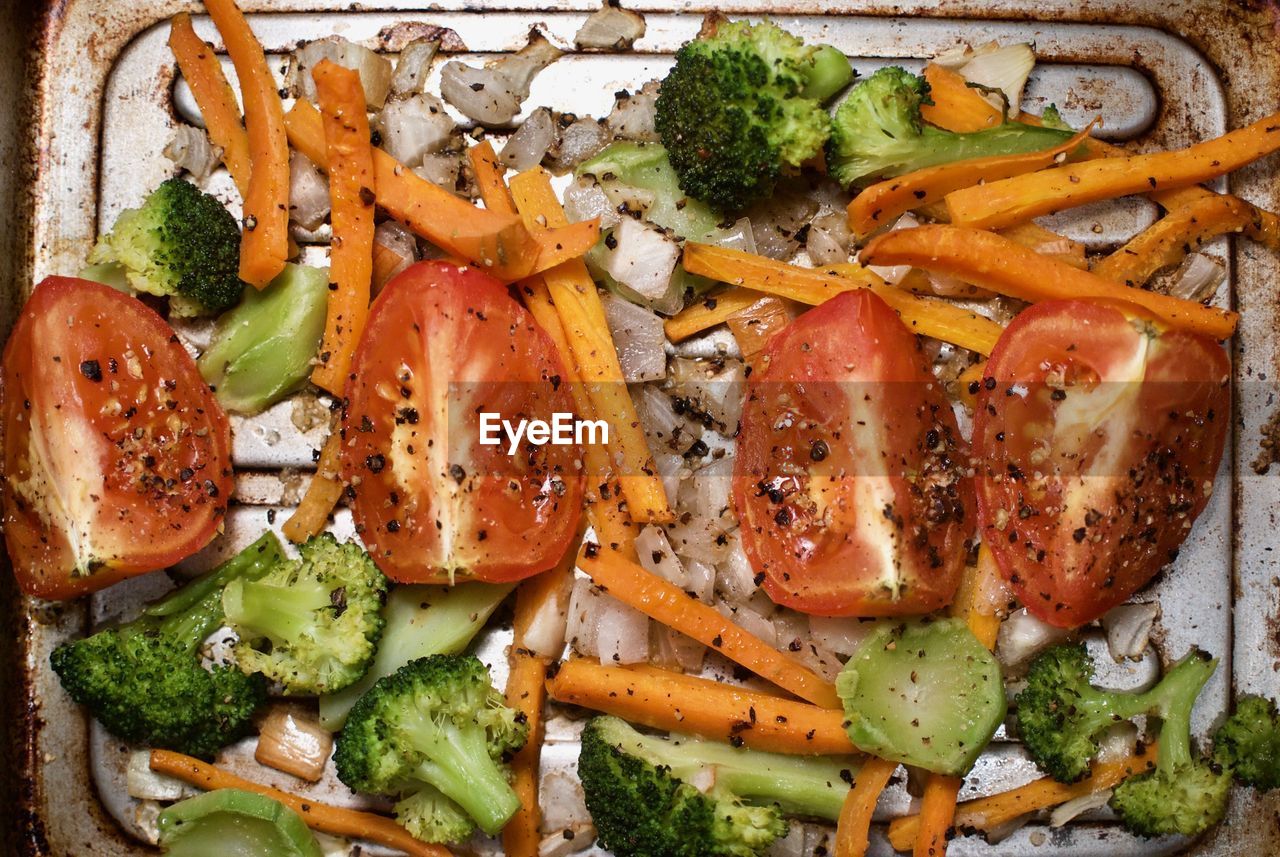 HIGH ANGLE VIEW OF CHOPPED VEGETABLES ON BARBECUE