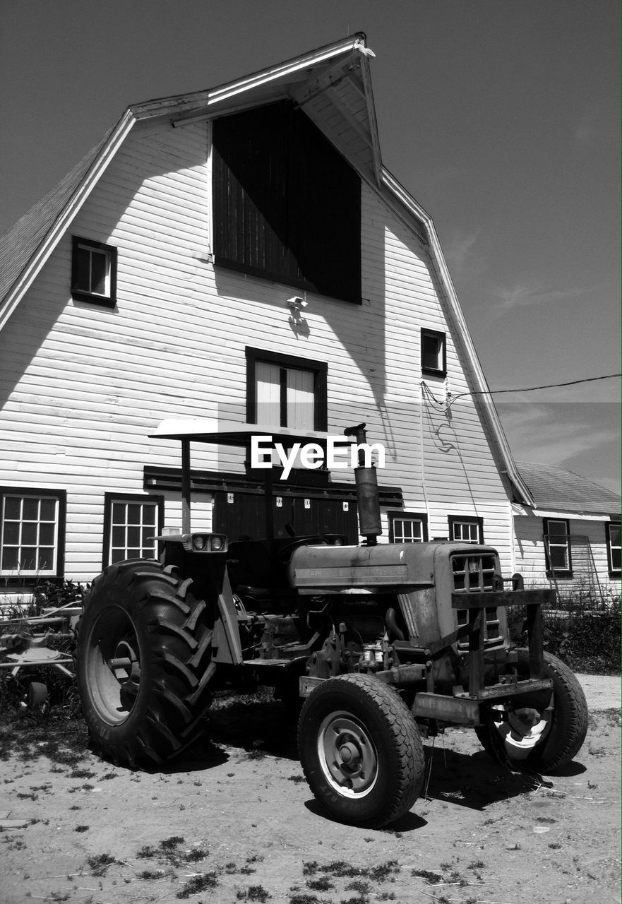 Tractor in front of a house