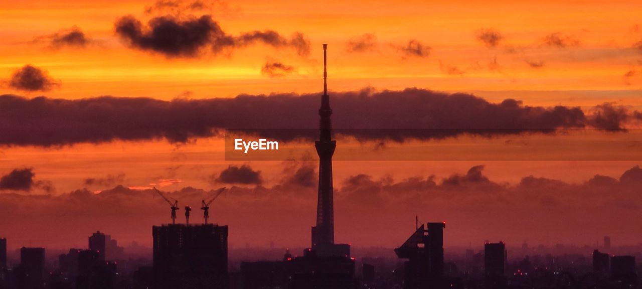 SILHOUETTE OF BUILDINGS DURING SUNSET