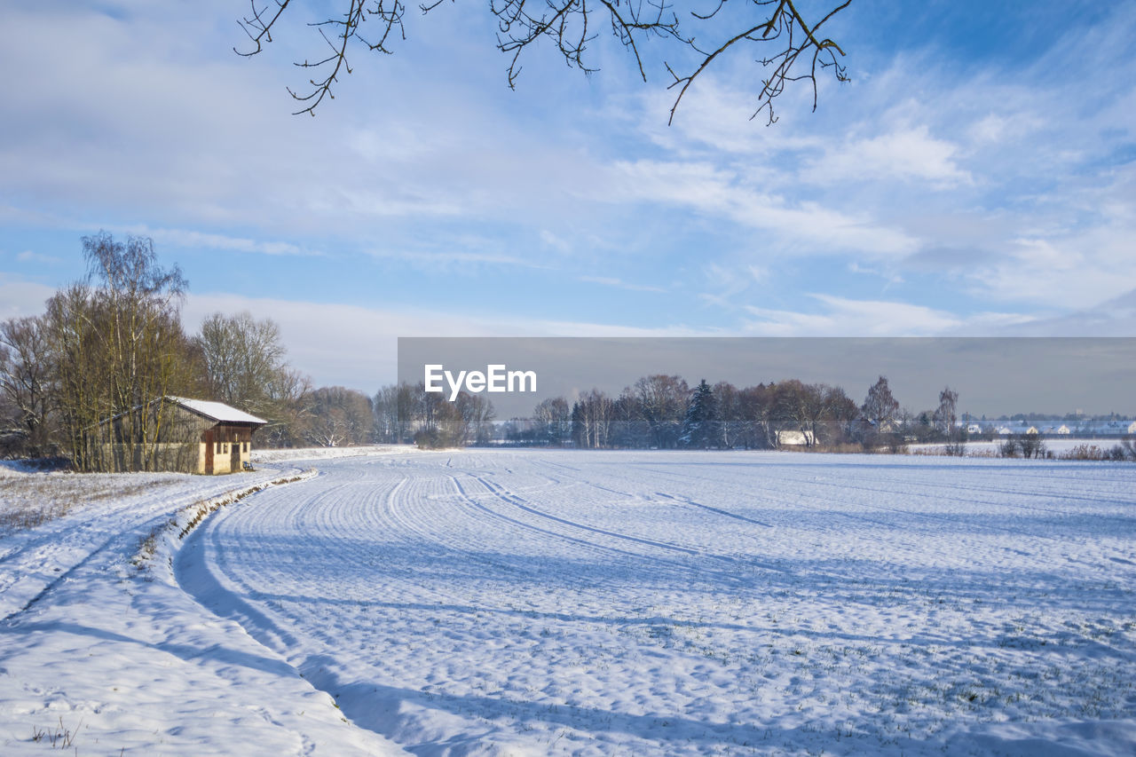 Scenic view of snow field against sky