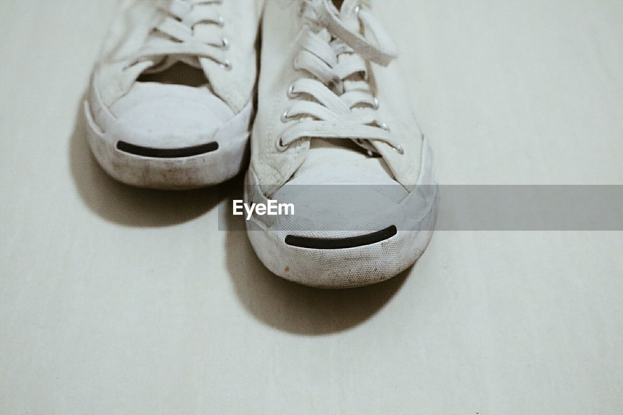 Close-up of canvas shoes on table