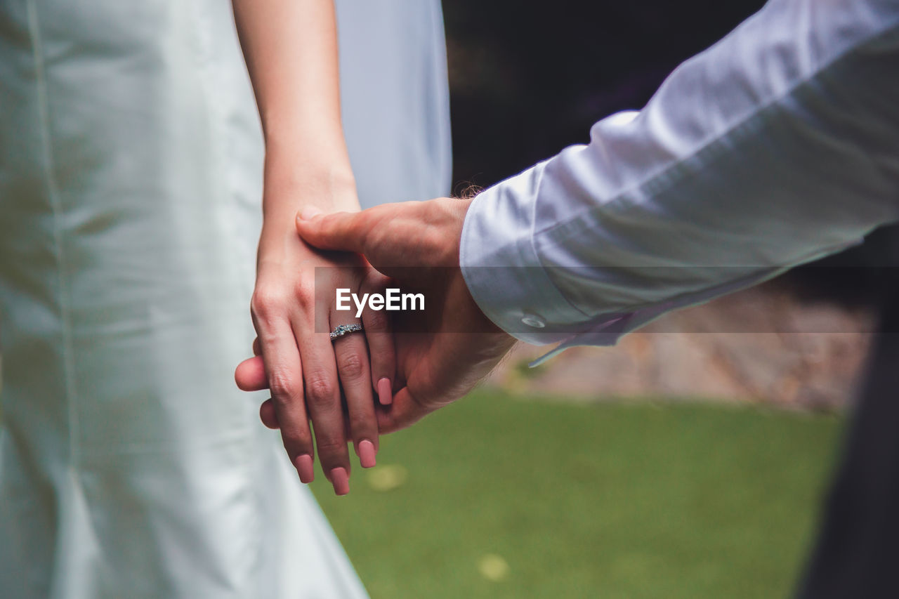 Bouquet in the hands of the groom. to make a happy wedding gift to a young bride.