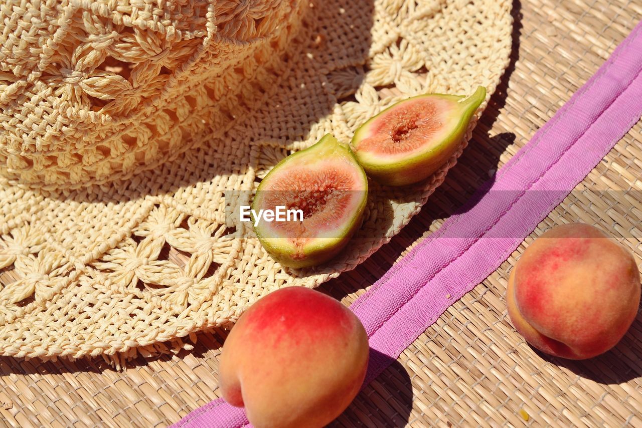 HIGH ANGLE VIEW OF FRUITS ON WOODEN TABLE