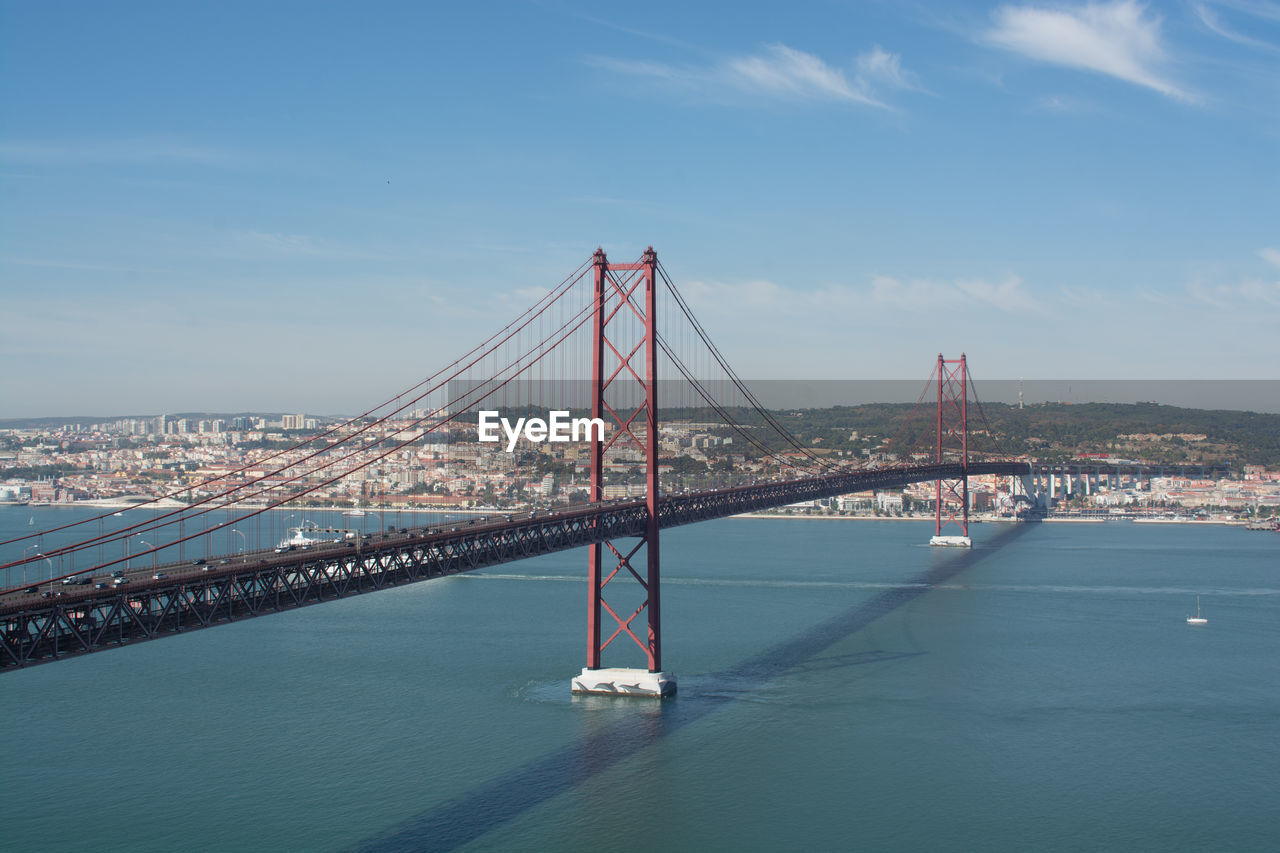 April 25th bridge over tagus river against sky