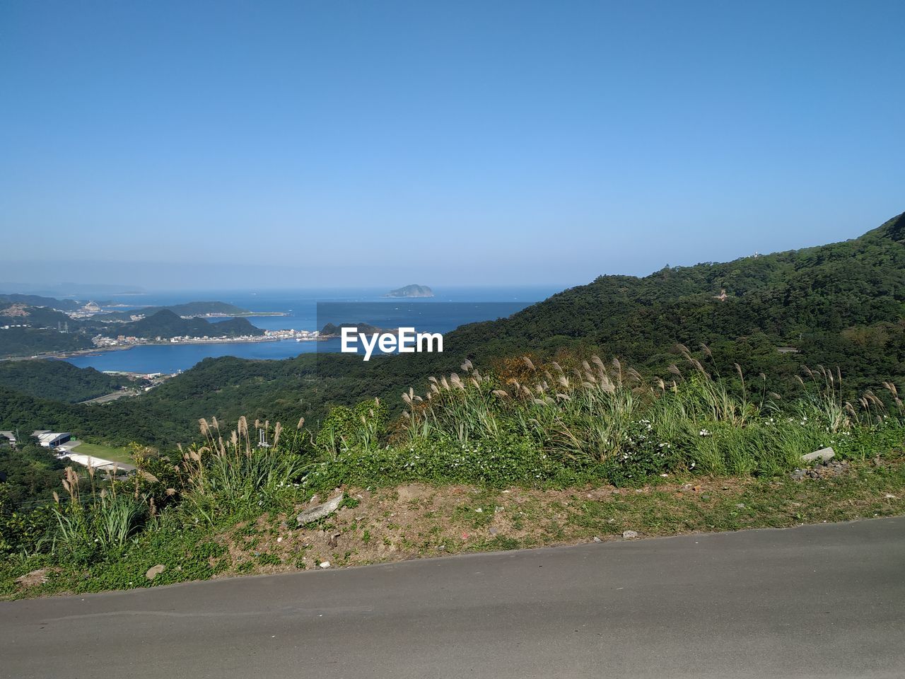 Scenic view of landscape against clear blue sky