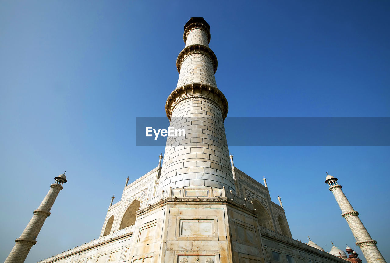 Low angle view of taj mahal against clear sky on sunny day