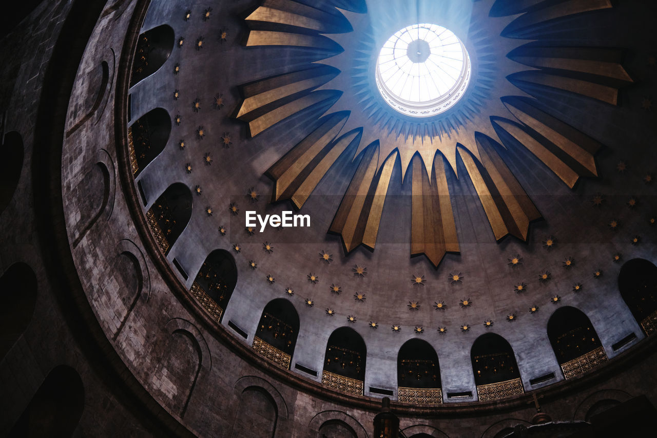 Low angle view of illuminated ceiling of temple holy sepulcher jerusalem 