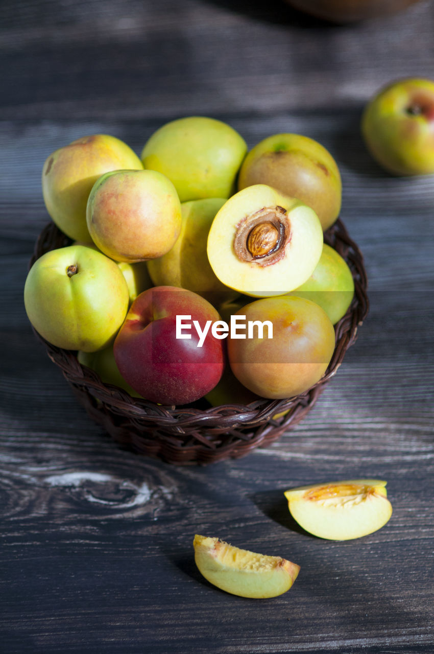 Delicious fresh peaches on the rustic wooden table