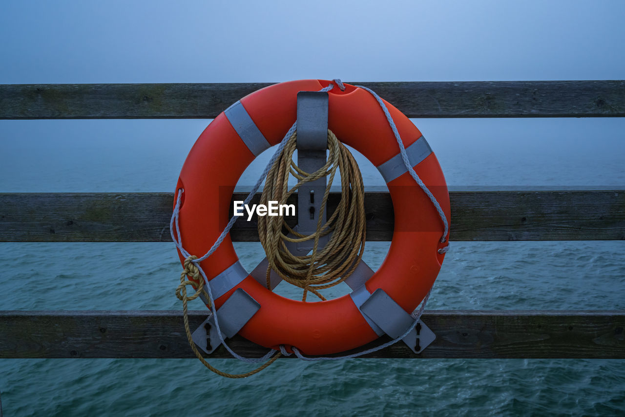 Lifebuoy on seabridge in wustow, darß, baltic sea 