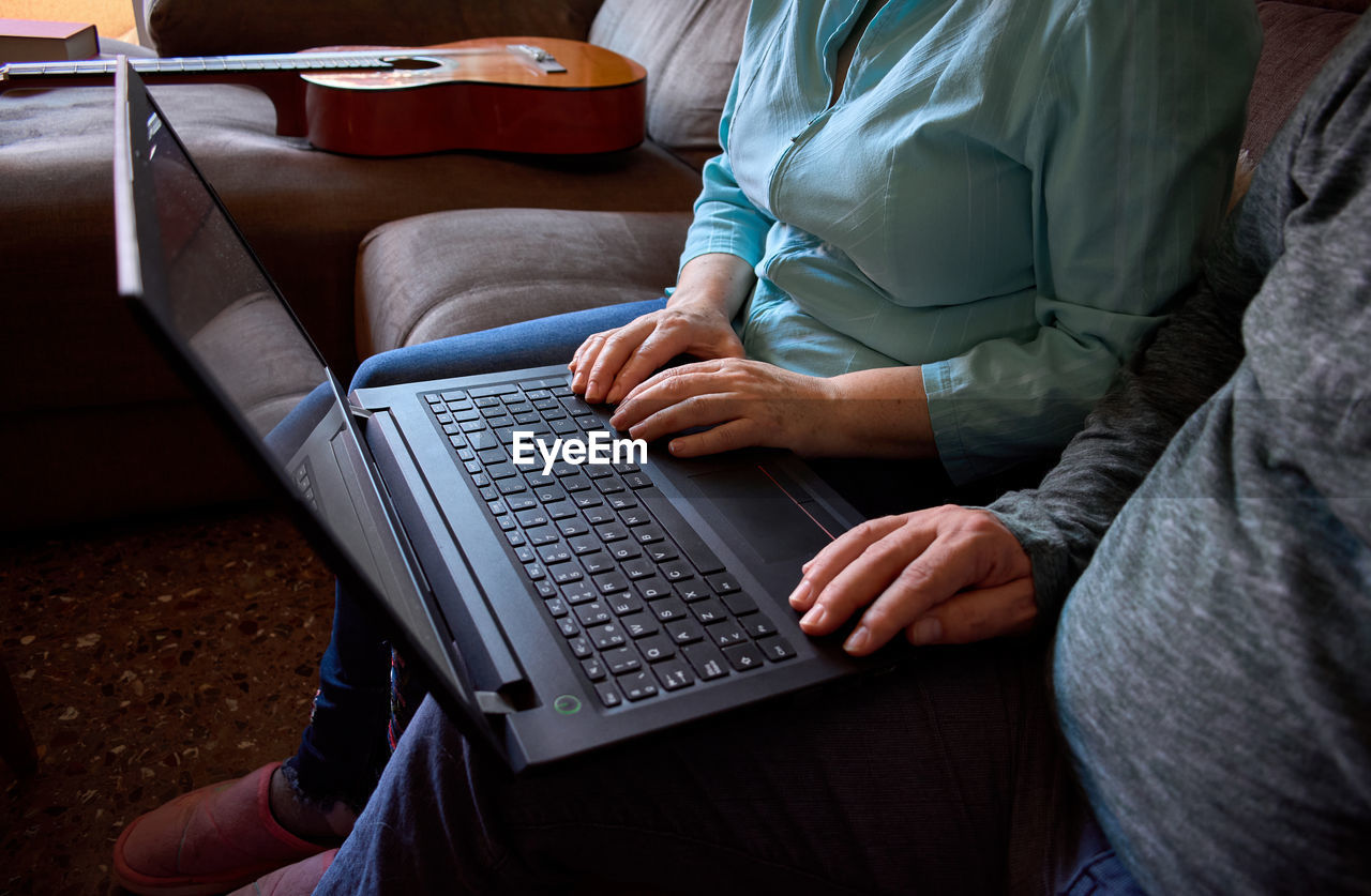 Close-up of husband and wife having an online conversation