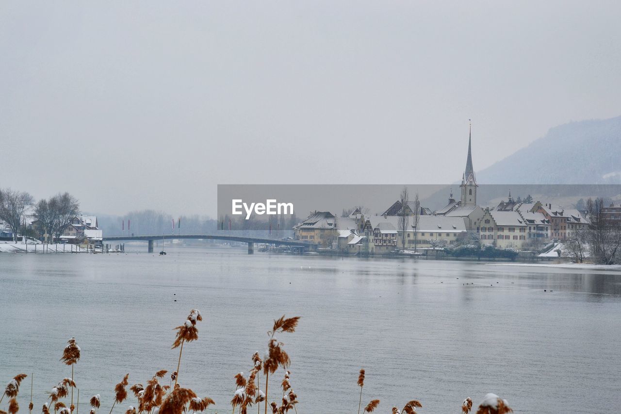 Scenic view of river and houses against sky at stein am rhein