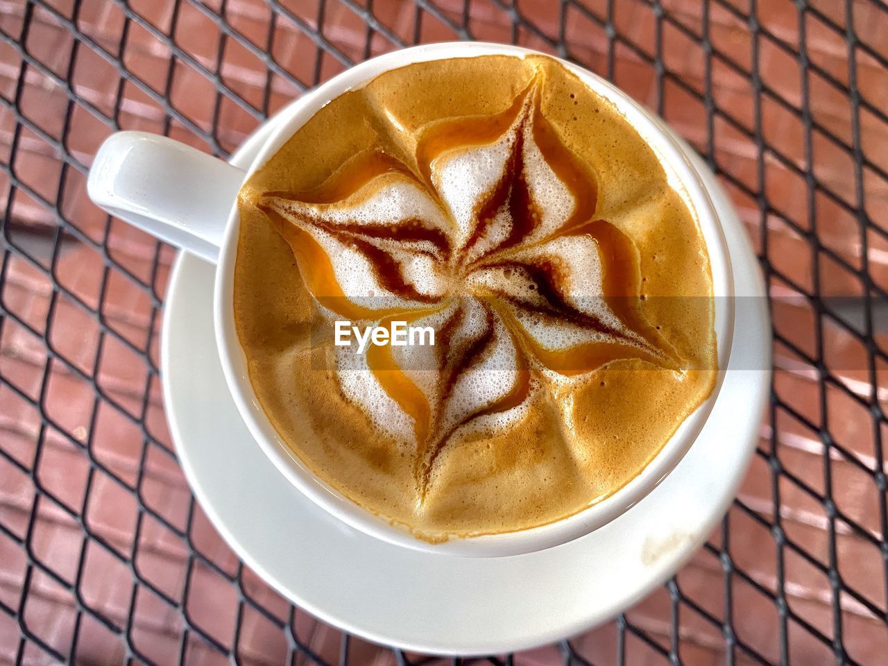 food and drink, drink, coffee, refreshment, cup, mug, latte, coffee cup, food, hot drink, dish, cappuccino, frothy drink, high angle view, still life, pattern, freshness, no people, froth art, directly above, close-up, saucer