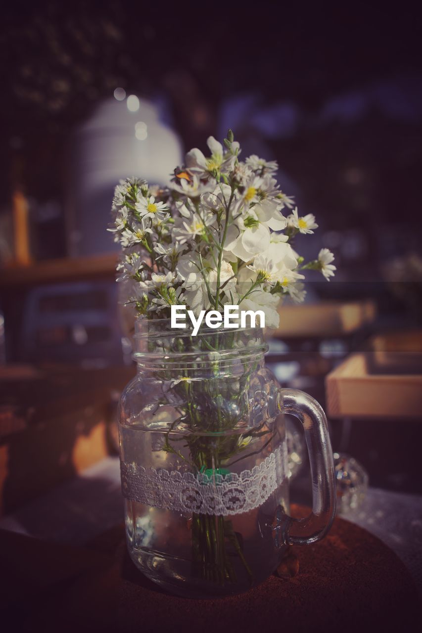 Close-up of glass vase on table