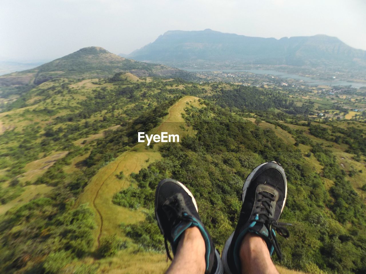 LOW SECTION OF WOMAN ON MOUNTAIN