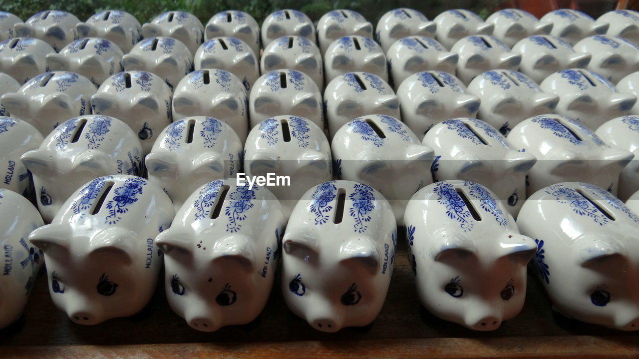 Piggy banks arranged on table for sale