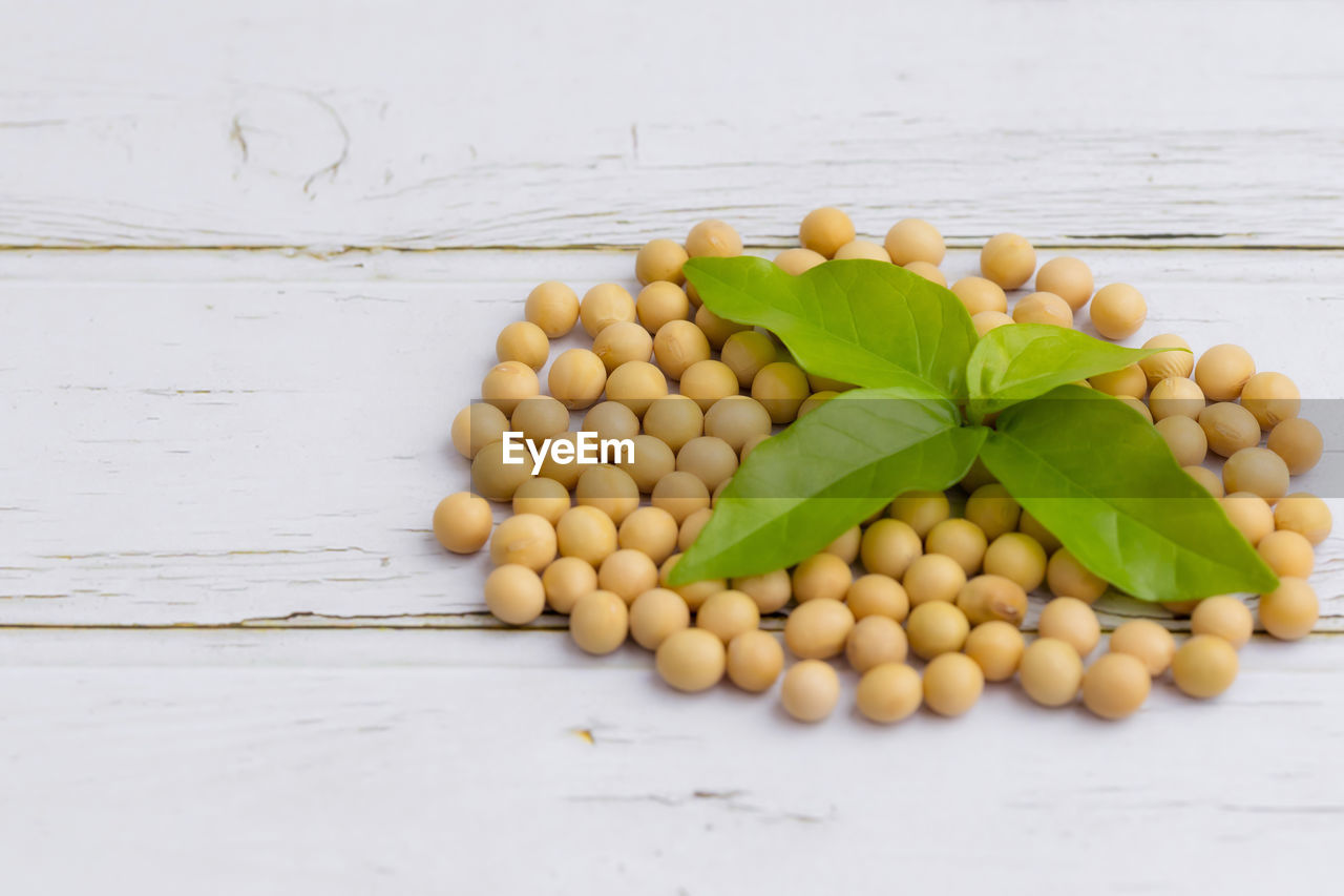 HIGH ANGLE VIEW OF FRUITS IN CONTAINER ON TABLE