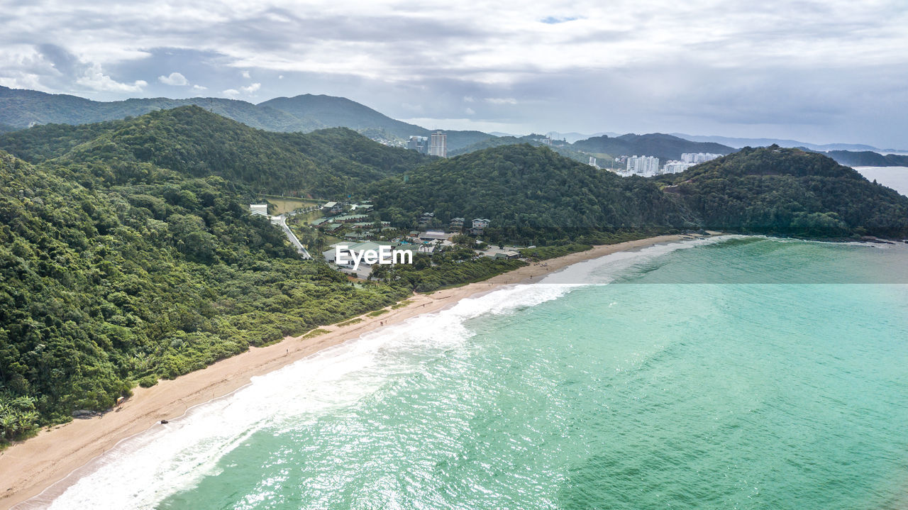 Aerial view of sea against mountain range