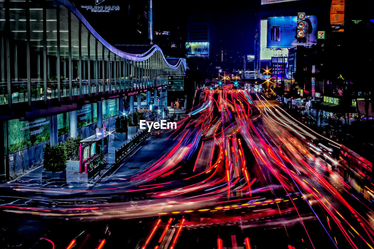 LIGHT TRAILS ON ROAD AT NIGHT