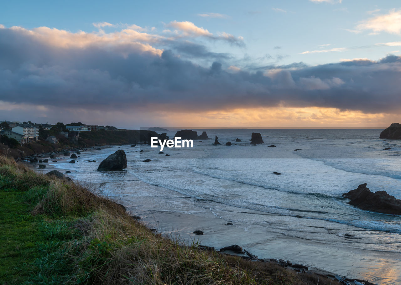 sky, water, sea, land, shore, coast, beach, body of water, cloud, ocean, wave, environment, sunset, scenics - nature, nature, landscape, beauty in nature, horizon, rock, wind wave, travel, travel destinations, coastline, seascape, dawn, bay, tourism, tranquility, outdoors, dramatic sky, sun, no people, evening, motion, trip, holiday, vacation, sand, horizon over water, tranquil scene, cliff, architecture, summer, sports, blue, cloudscape, sunlight, terrain, twilight, tide, island