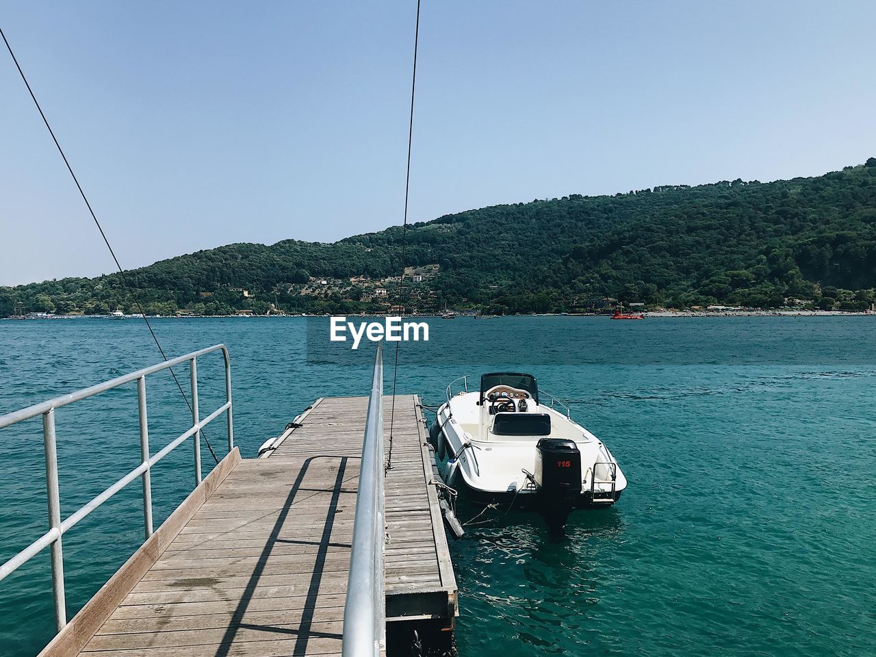 BOAT IN SEA AGAINST CLEAR SKY