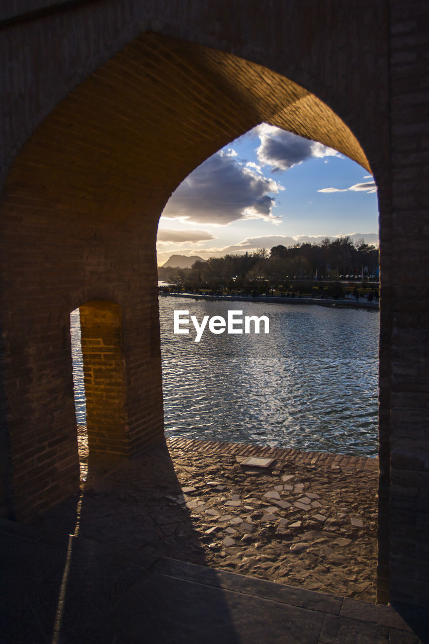 ARCH IN SEA AGAINST SKY