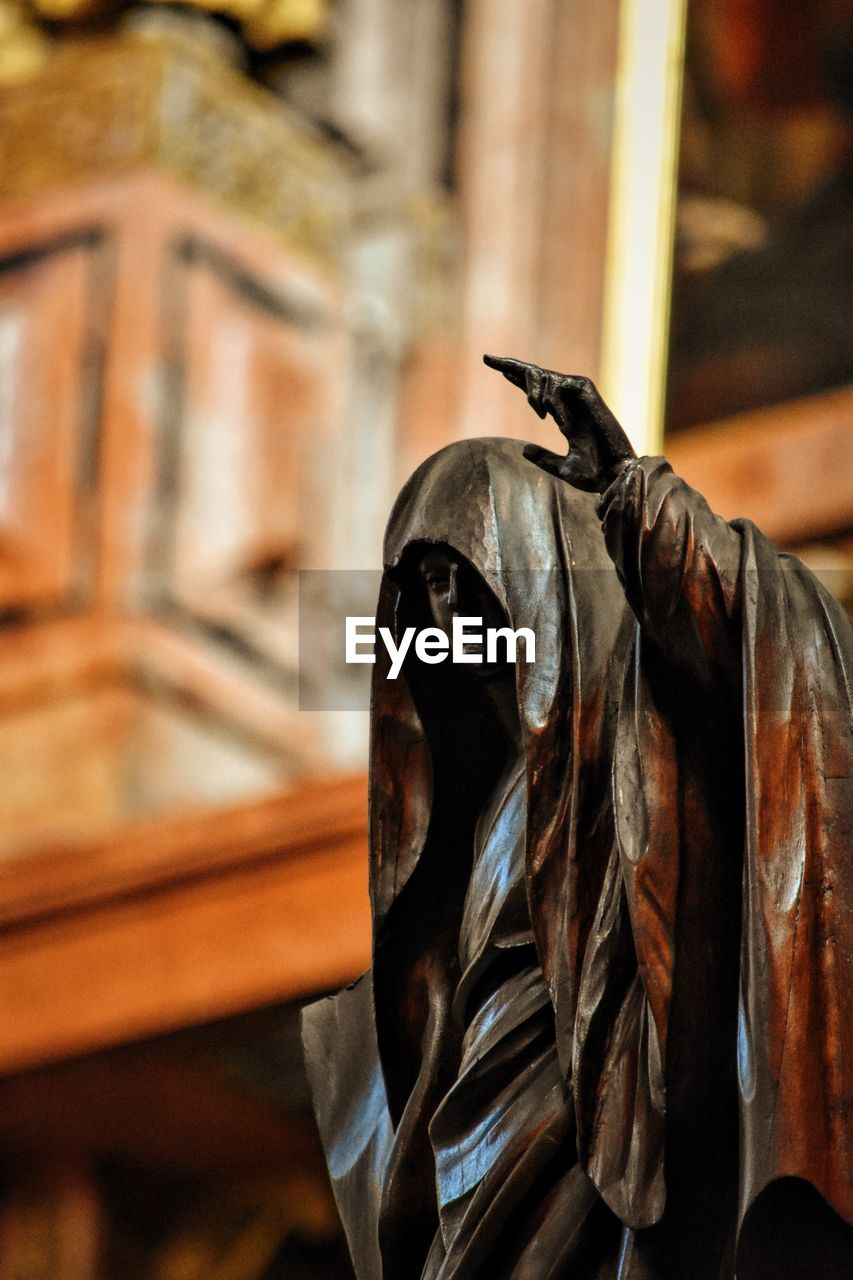 Low angle view of statue against building