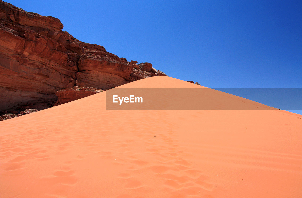 SCENIC VIEW OF DESERT AGAINST CLEAR BLUE SKY