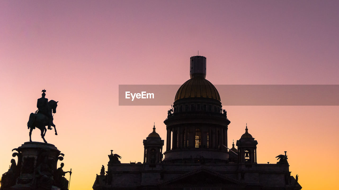 Low angle view of historic building against sky during sunset