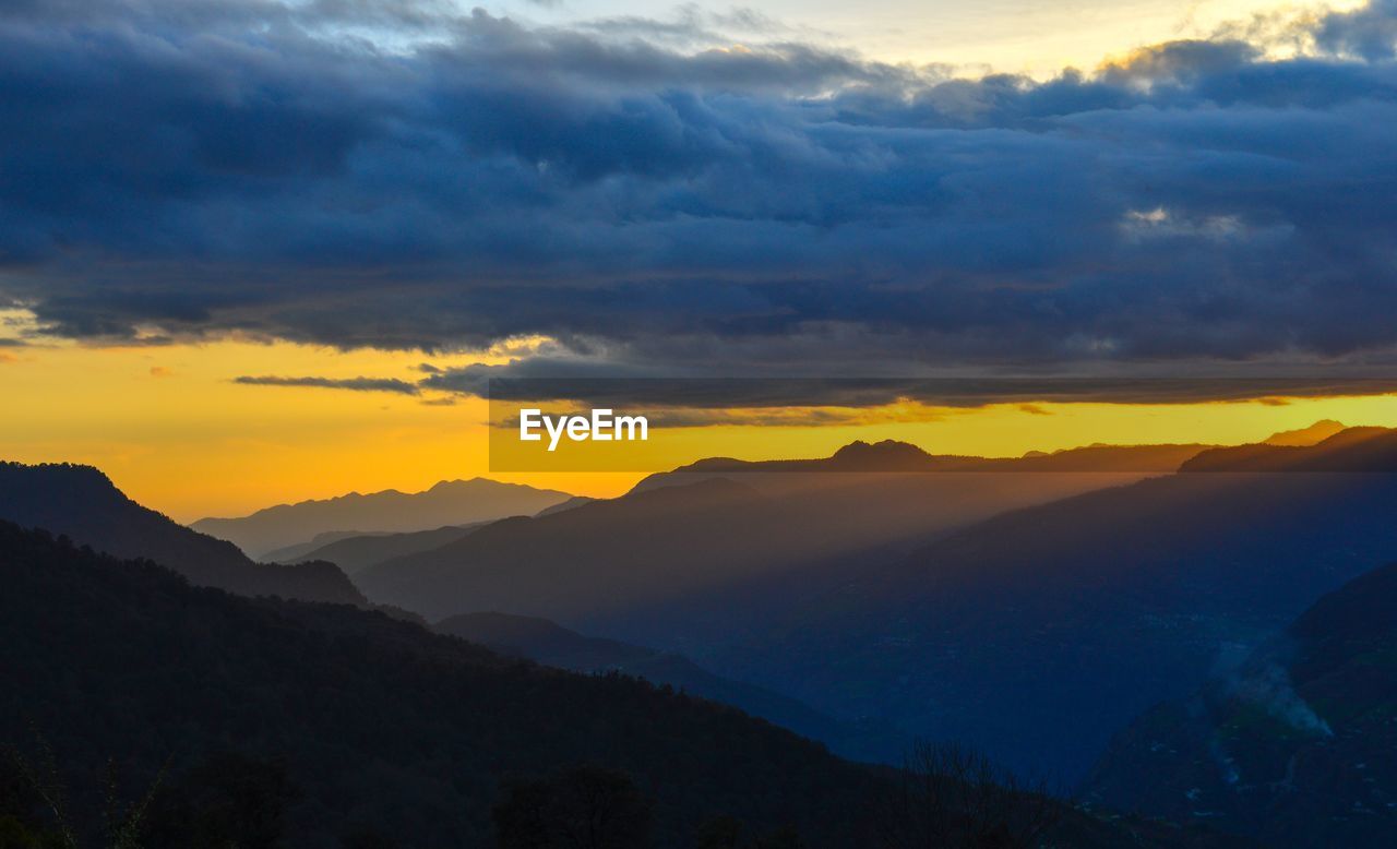 Scenic view of dramatic sky during sunset