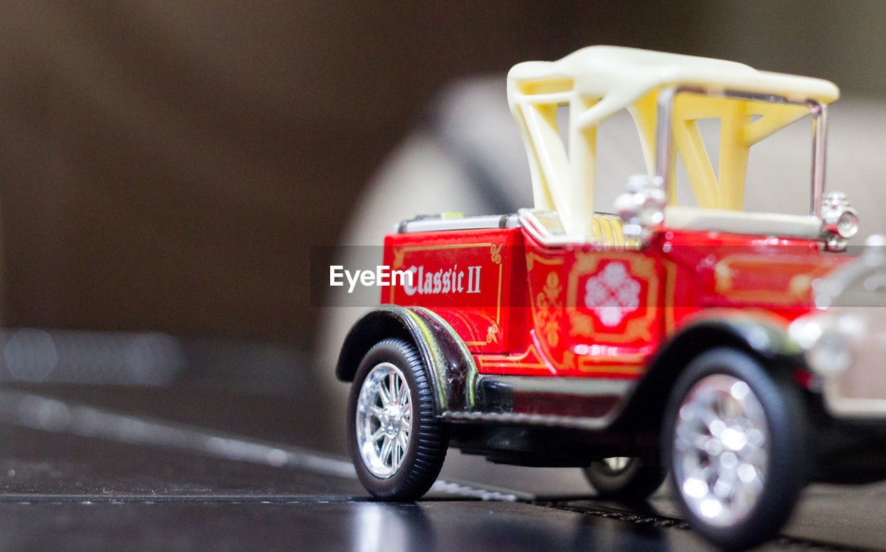 Close-up of toy car on floor at home