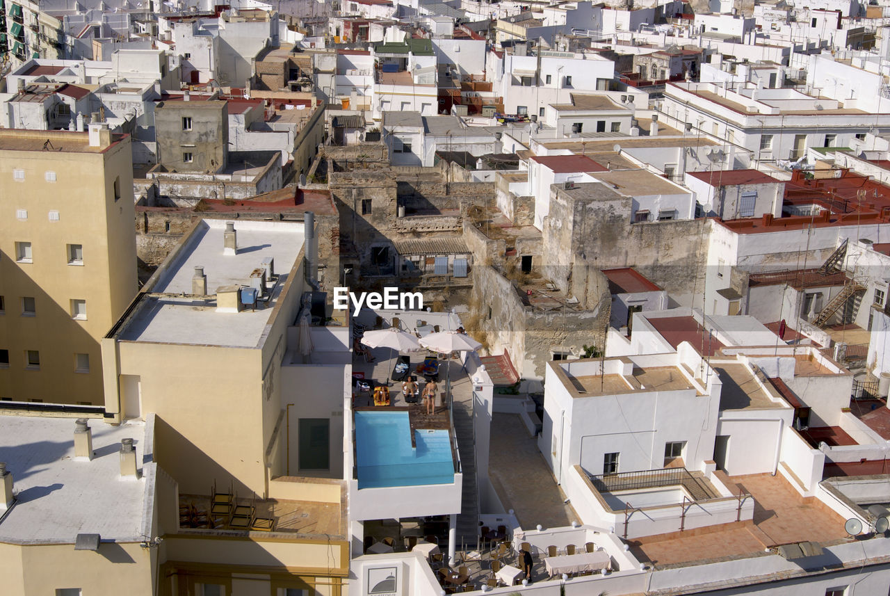 High angle view of buildings with private swimming pool in town