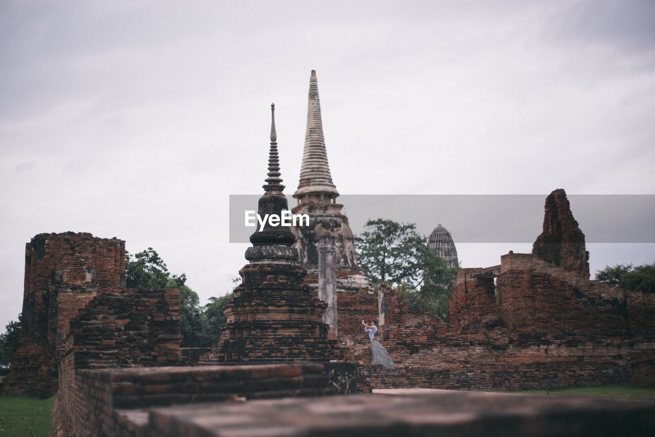 LOW ANGLE VIEW OF OLD TEMPLE BUILDING