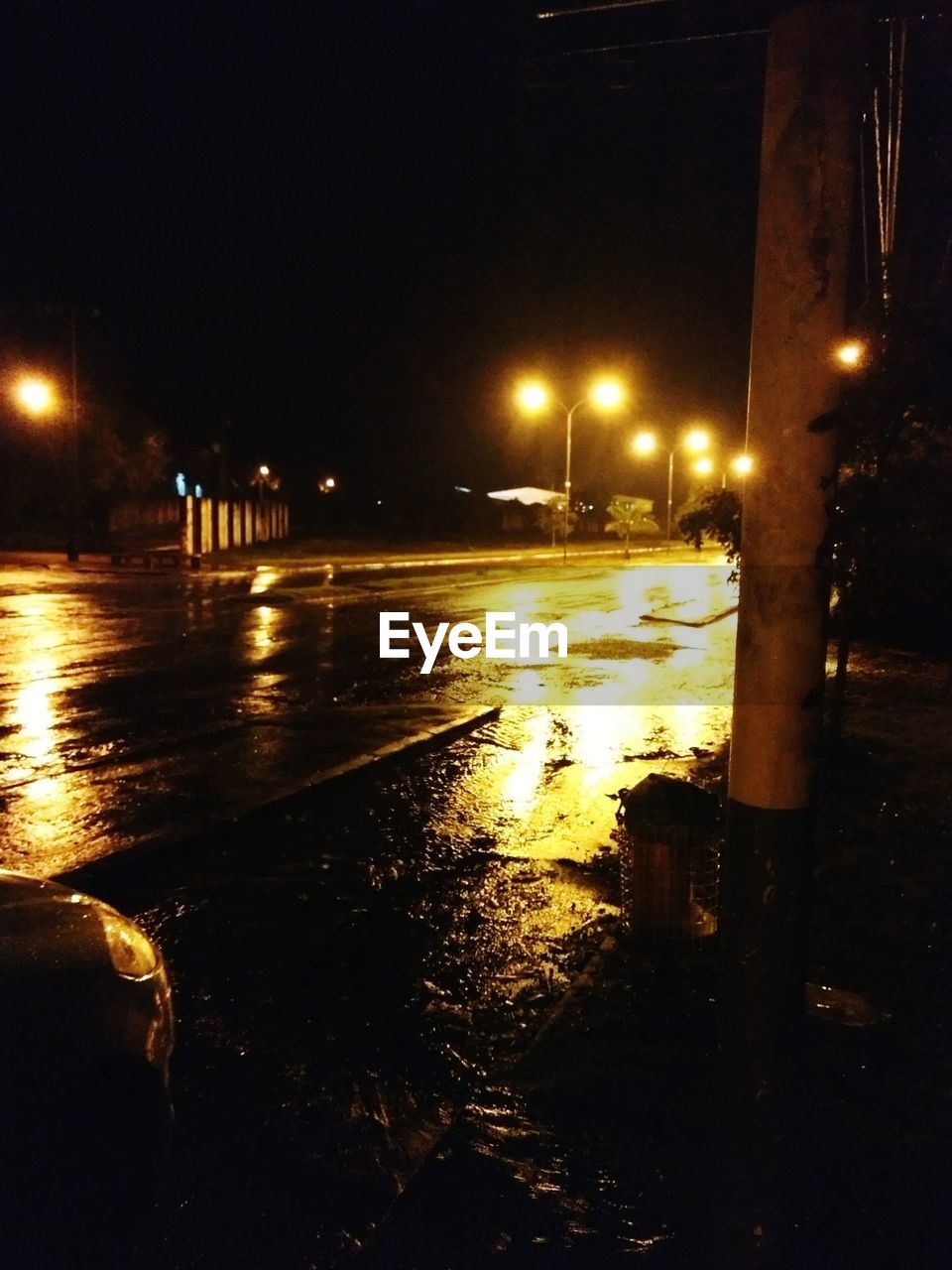 WET ROAD IN CITY DURING NIGHT