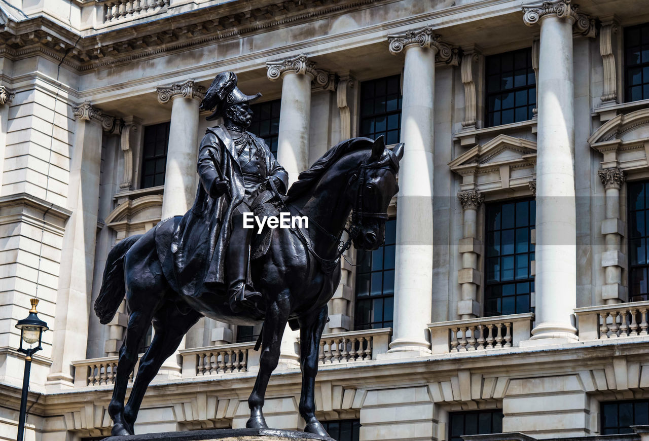 STATUE IN FRONT OF BUILDING