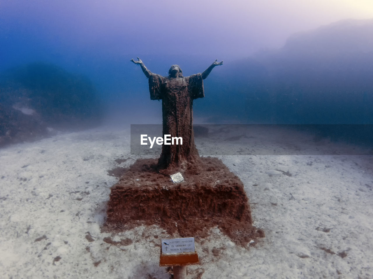The statue of jesus christ near the wreck of the mv imperial eagle in malta