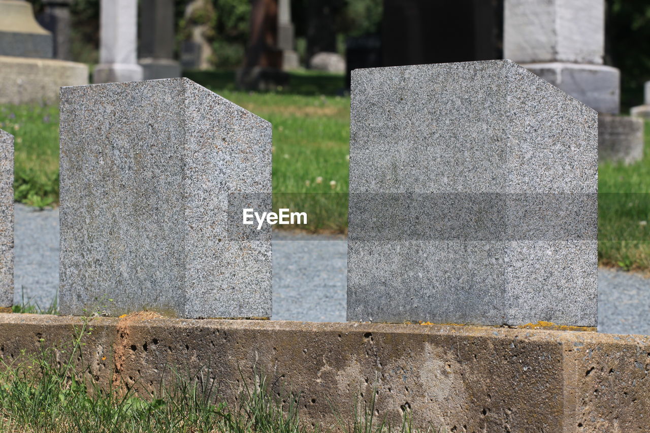 View of stone cross in cemetery