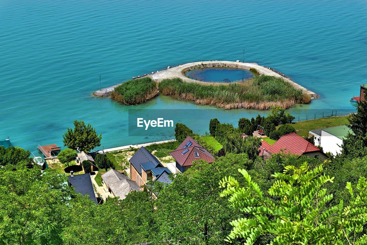 High angle view of sea and buildings