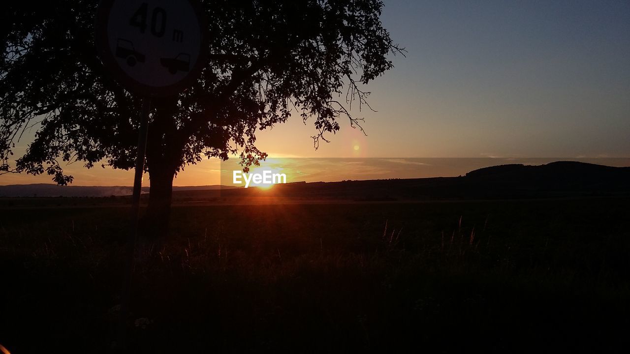 SCENIC VIEW OF SUNSET OVER LANDSCAPE