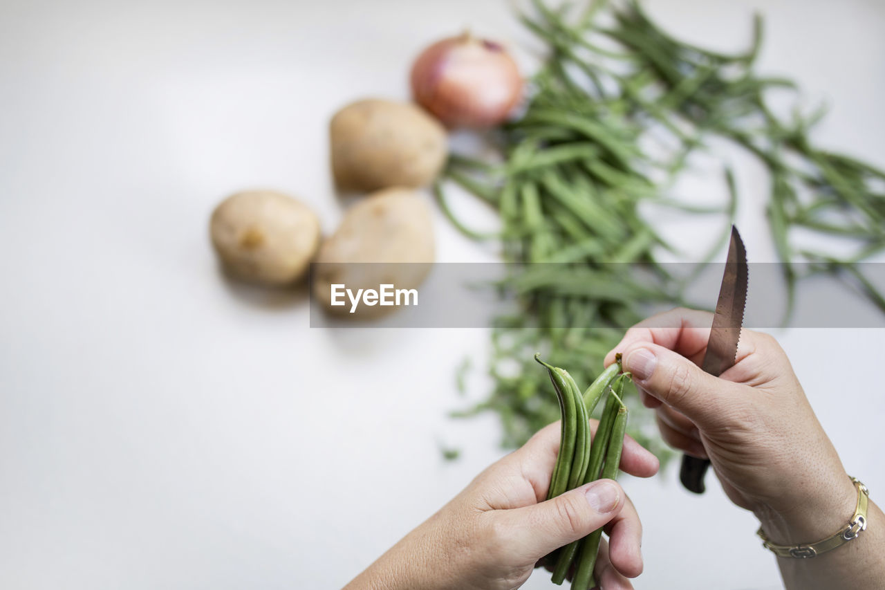 Close-up of person hand holding vegetables