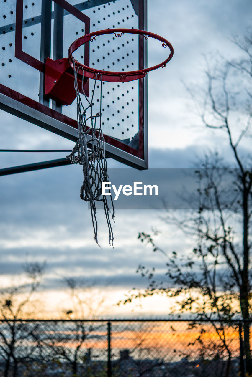 Low angle view of basketball hoop against sky