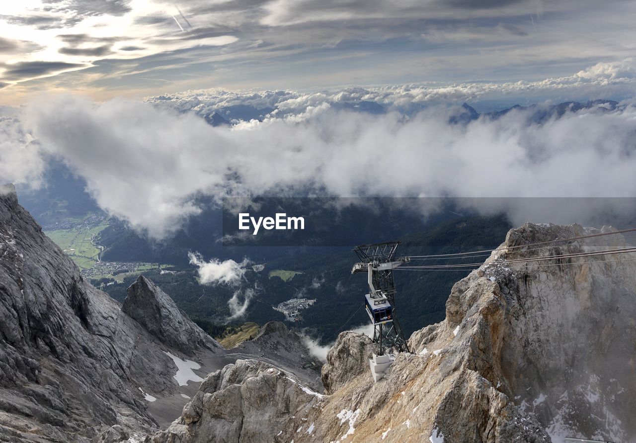 Panoramic view of snowcapped mountains against cloudy sky