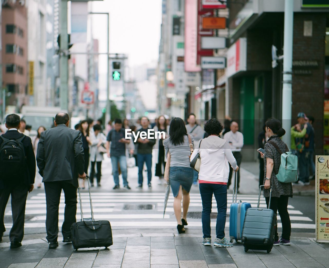 People walking on street in city