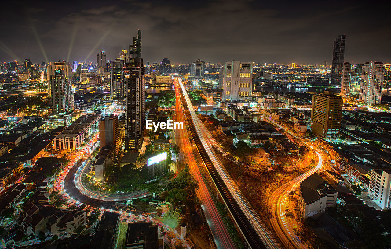 Aerial view of illuminated buildings in city at night