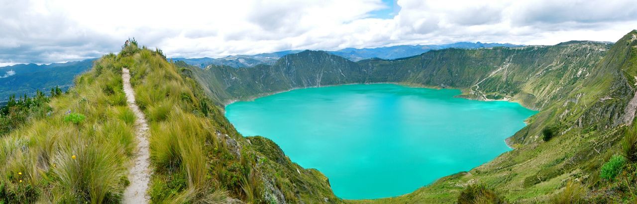 SCENIC VIEW OF MOUNTAINS AGAINST CLOUDY SKY