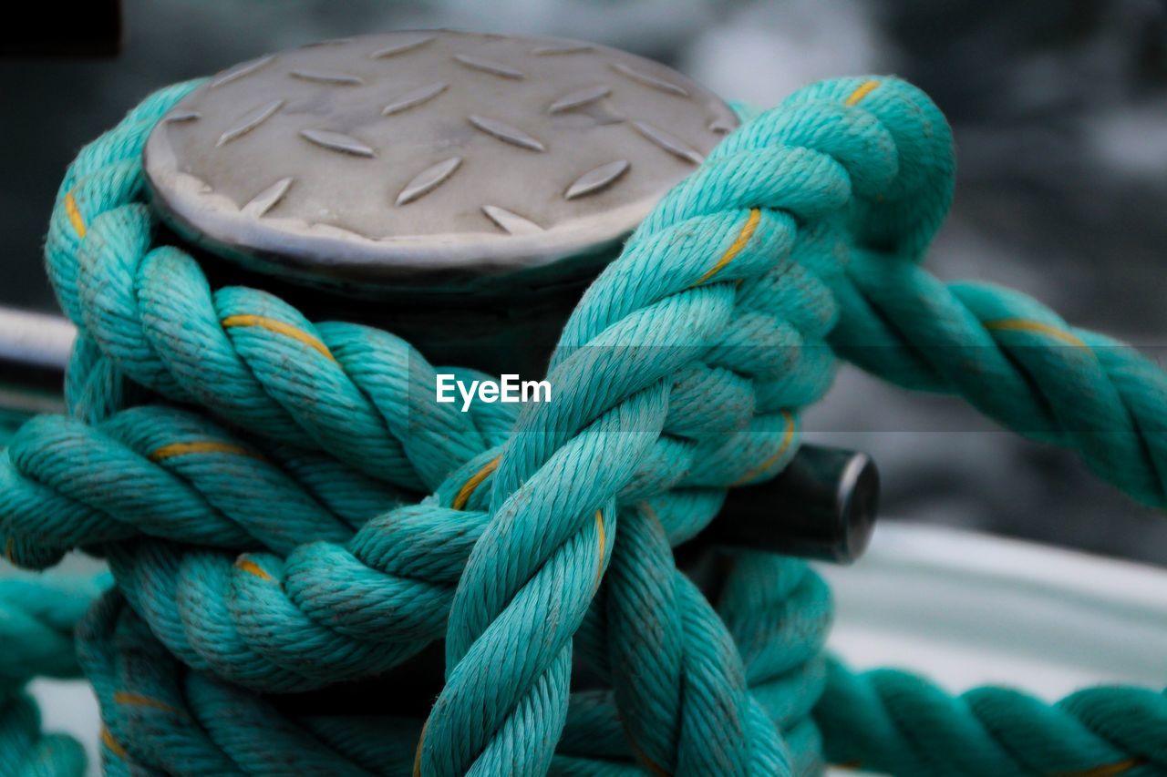 Close-up of rope tied up on cleat