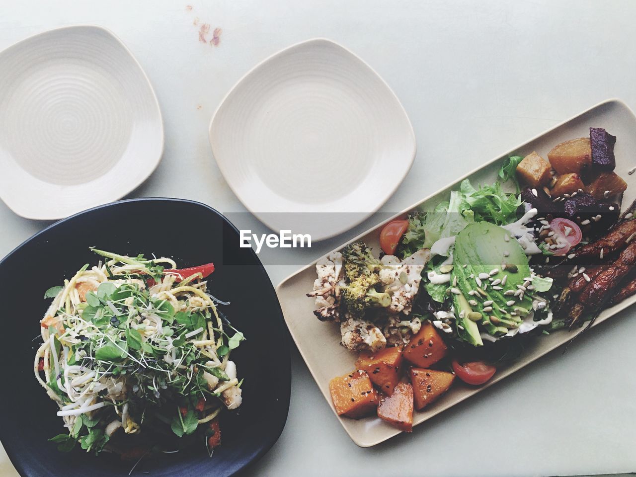 High angle view of grilled vegetables and salad served in plate