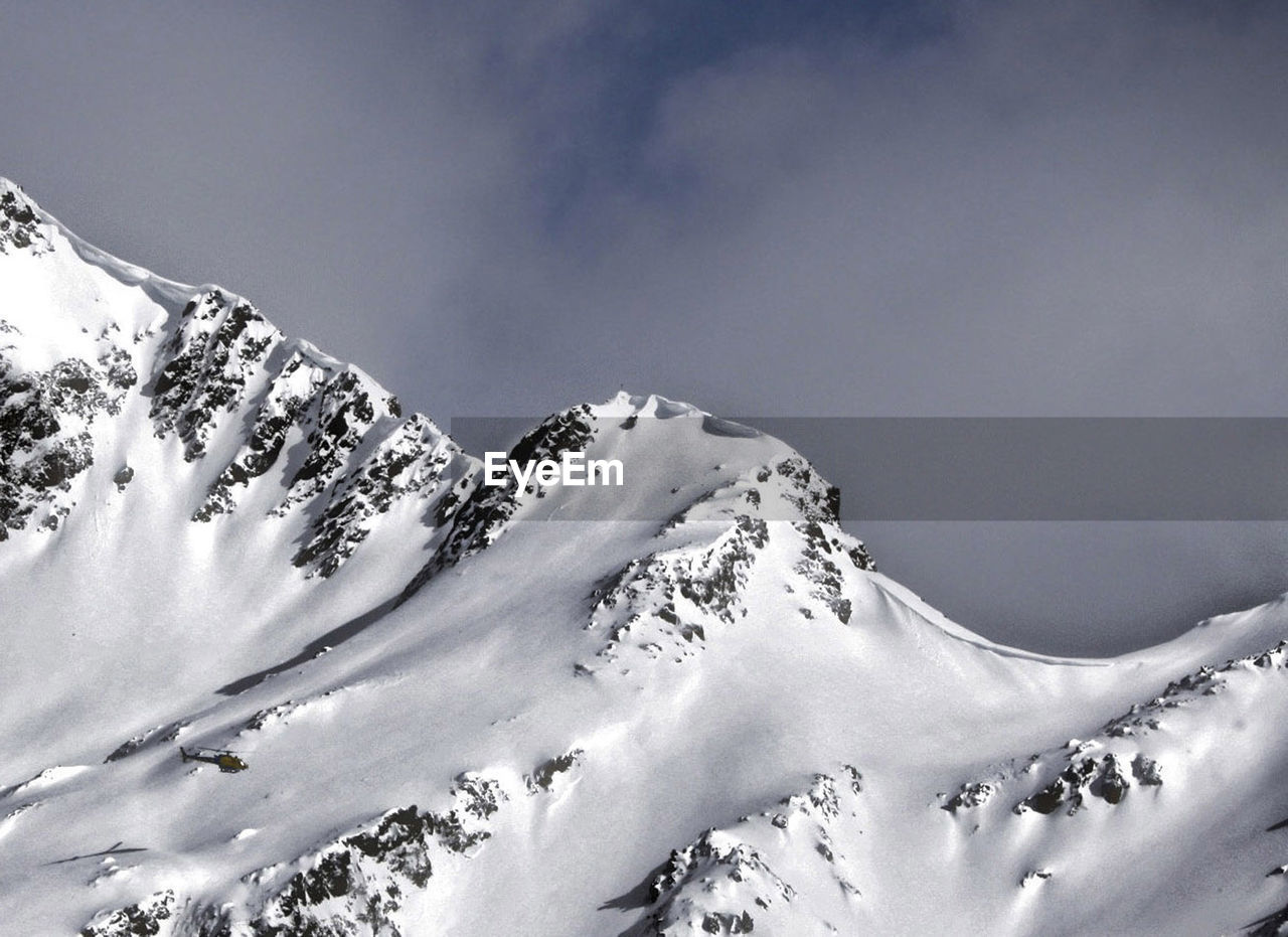 Snow covered mountain against sky