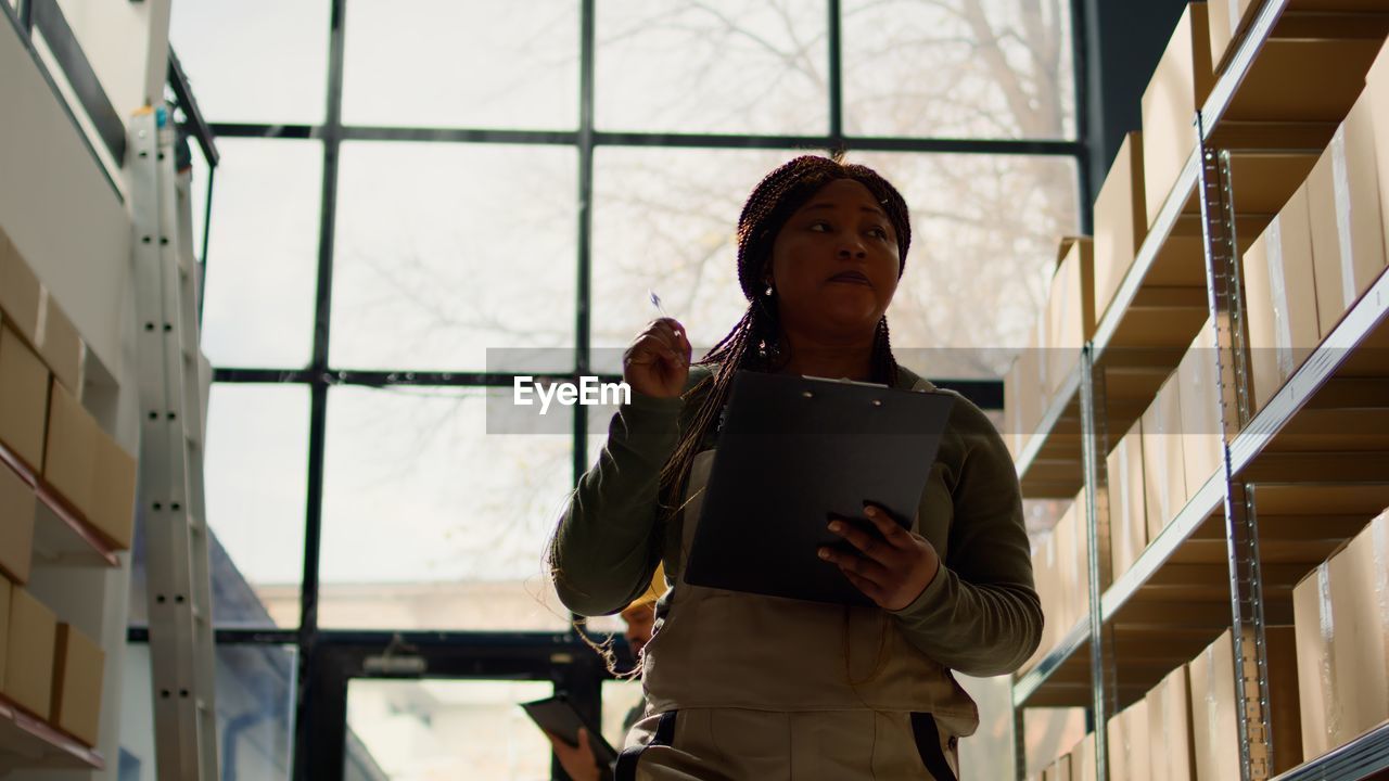 portrait of young woman using mobile phone