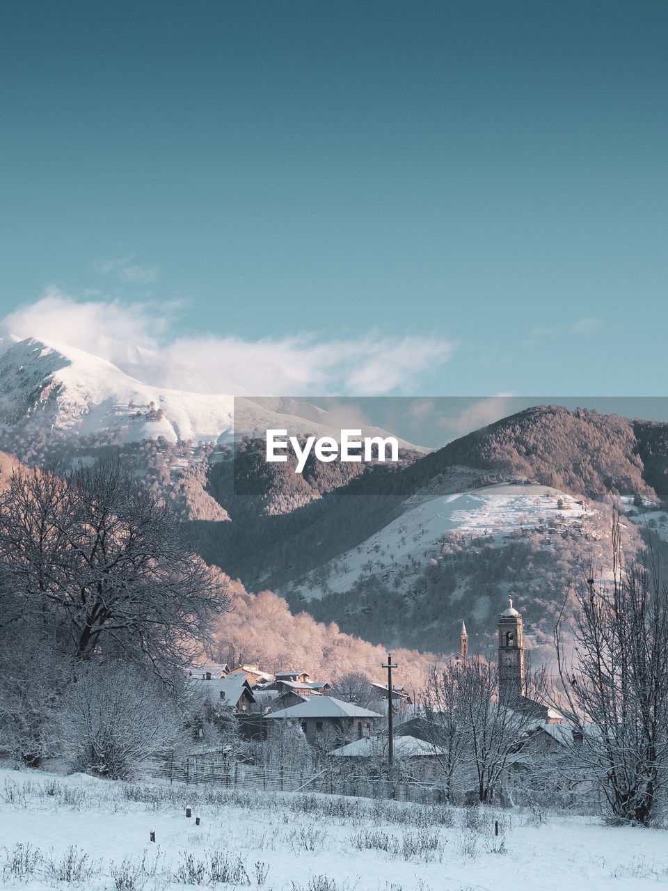 Scenic view of snow covered mountains against sky